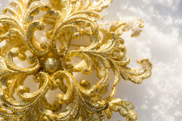 Golden Snowflake on Snow