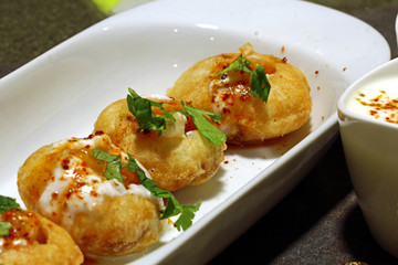 Panipuri or Gol Gappa or Chaat, Indian Street Food, Panipuri, Golgappe, Chat item, India, Stuffed Panipuri with aloo and Sweet Tamarind - Indian Food © Dipali S