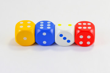 Red blue yellow white wooden playing dice