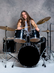Fototapeta premium musician with his black drum set