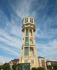 Fototapeta na wymiar Old wooden water tower in square of Siofok
