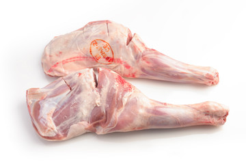 raw lamb shoulders on white background