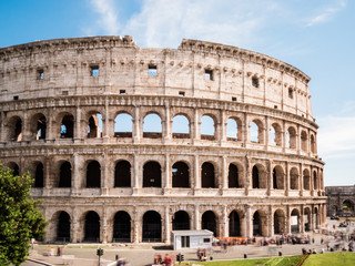 Fototapeta na wymiar Close-up of the awesome ancient Colosseum in Rome, Italy on a sunny June 2015 day with blue sky. 