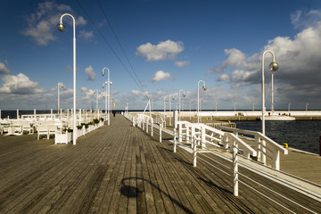 rain passing over a wooden, sea pier