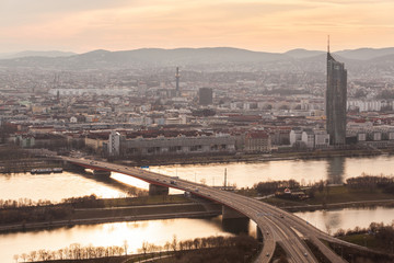 Wien at sunset, with Danube river, highway and buildings