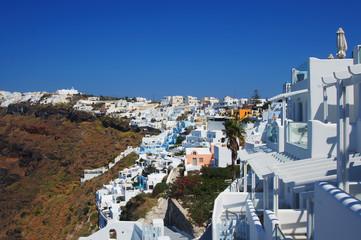 Settlement with beautiful white houses on the hill on Santorini