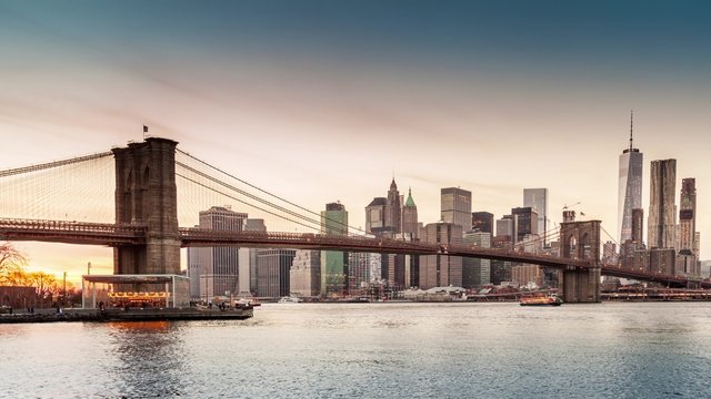 Timelapse with Brooklyn Bridge and Lower Manhattan going through sunset, dusk and night