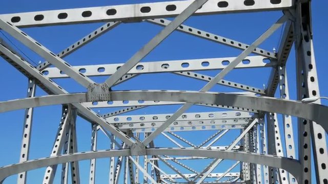 Driving under steel canopy of cantilever bridge which crosses over Mississippi River in Baton Rouge Louisiana.