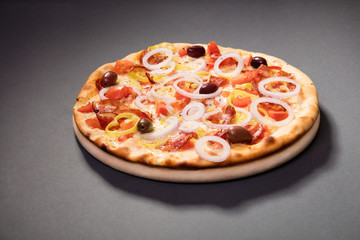 Pizza Vesuvio with mozzarella, tomato sauce, ham, olives... serve