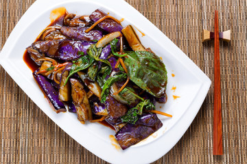 Prepared juicy eggplant and basil herb dish