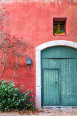 Fototapeta na wymiar Mediterranean wall with door and window
