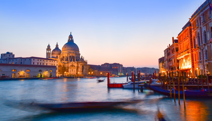 Basilica Santa Maria among the Grand Canal and traditional gondolas in Venice city, 