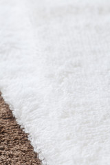 White clean towel on brown towel background