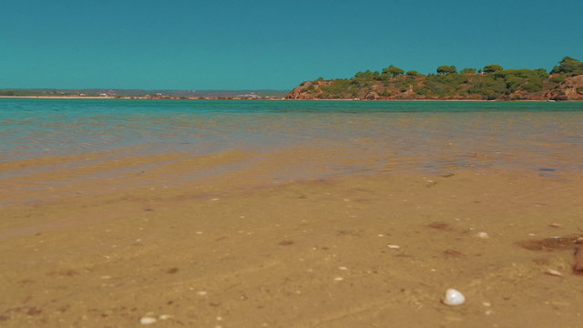 Opener inspirational shot showing the pristine turquoise waters of the Algarve coast in Portugal
