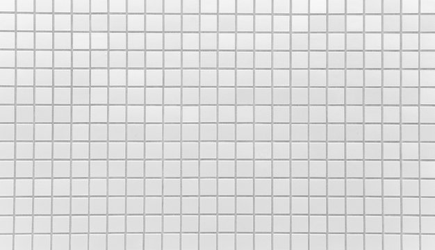 White brick tile wall texture and background seamless .
