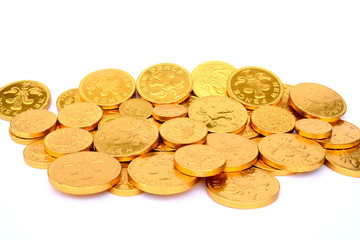 Golden coins idolated in white
