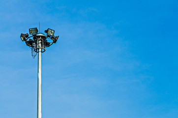 Spotlight tower on blue sky background