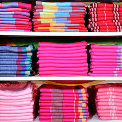 Colourful Tibetan Fabric Neatly Arranged in Shelving