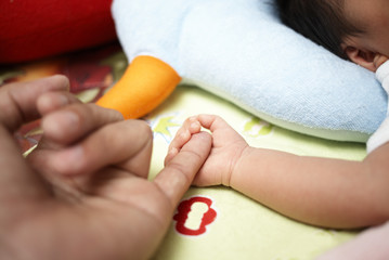 hand's baby. shot of indoor.