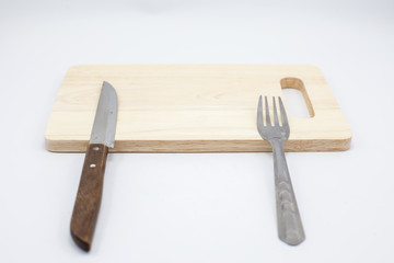 Wooden cutting board and knife