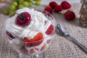 Closeup of dessert with strawberries and cream