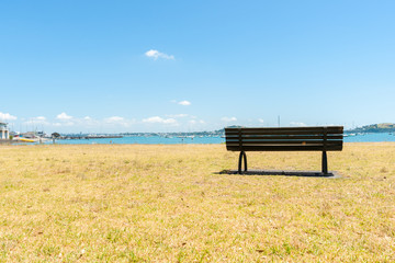 Fototapeta premium Empty bench seat in the bay.