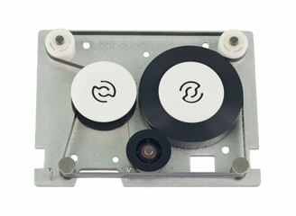 Mini data cartridge tape for computer.  Cartridge without upper lid. Object is isolated on white background without shadows.
