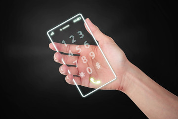 Hand holding light cell phone digital the future on dark backgro