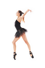 oung beautiful baliet dancer posing on a studio