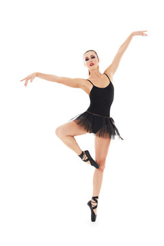 oung beautiful baliet dancer posing on a studio