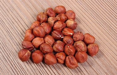 Heart of brown hazelnut on wooden table