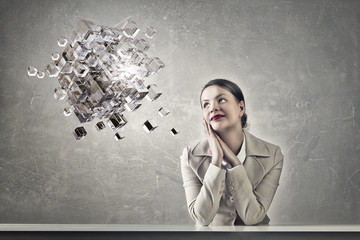 Attractive businesswoman sitting at table
