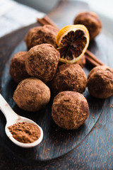 Raw chocolate candy with nuts, figs and citrus, truffle