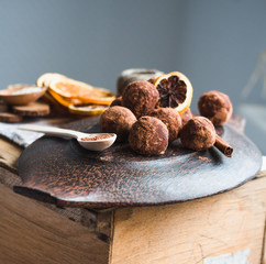 Raw chocolate candy with nuts, figs and citrus, truffle