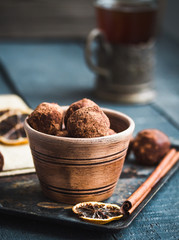 Raw chocolate candy with nuts, figs and citrus, truffle