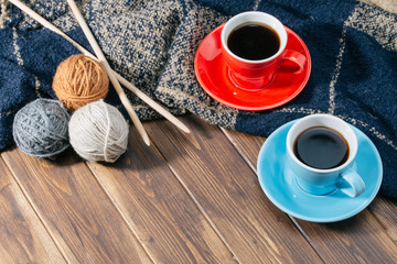 Ball of wool and Coffee on wooden floor