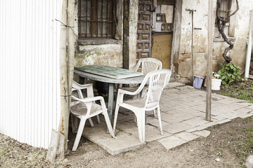 Fototapeta na wymiar Chairs in abandoned house