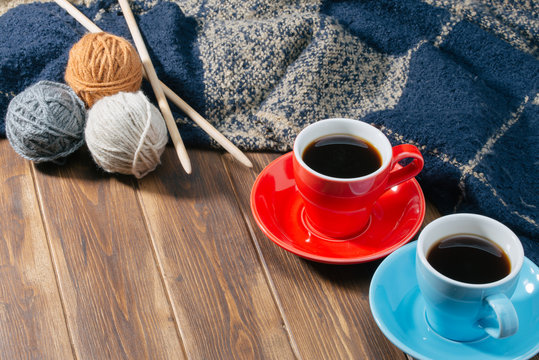 Ball of wool and Coffee on wooden floor