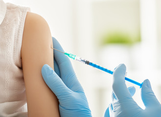 a vaccination to a child