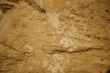 Picture of massive ocher brown rock with nice Grain and structure / Ocher Sandstone at west end of...