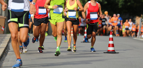 male and female during the run of the marathon race