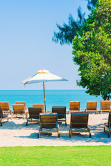 Umbrella pool and chair on the beach