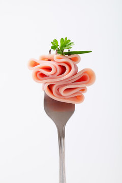 slice of ham on a fork
