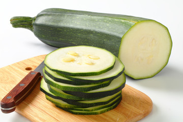 sliced zucchini on a cutting board