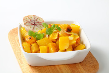 Roasted pumpkin cubes and garlic