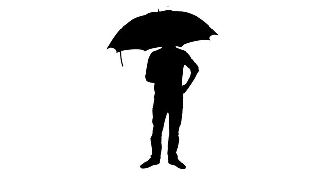Umbrella silhouette standing man - 1080p. Silhouette of a man standing with an umbrella - Full HD