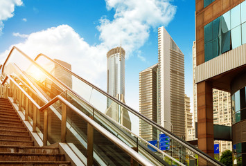 Escalator of Shanghai streets, skyscraper buildings.