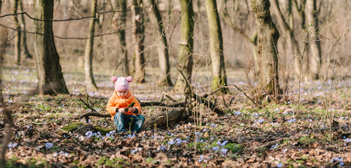 baby girl in the woods