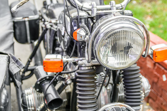 Close-up of a motorcycle headlight. Horizontal view of a motorcy
