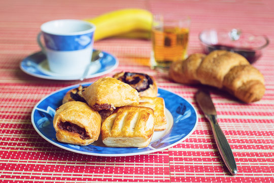 Delicious pastry with jam fruit and drinks for breakfast